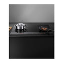Fisher & Paykel CI905DTB4 90cm Black Glass Induction Cooktop w/ SmartZone, Front top view with cooking dish and frying pan